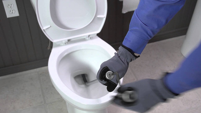 How Plumbers Unclog a Toilet